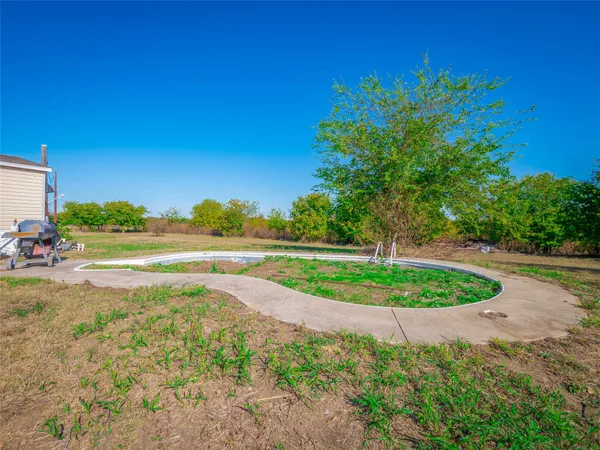 a view of a lake with a yard