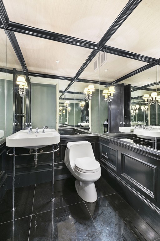 2 Avery Street, Unit 24H Boston, MA 02111 - Photo 12 of 14 a bathroom with a sink and a mirror