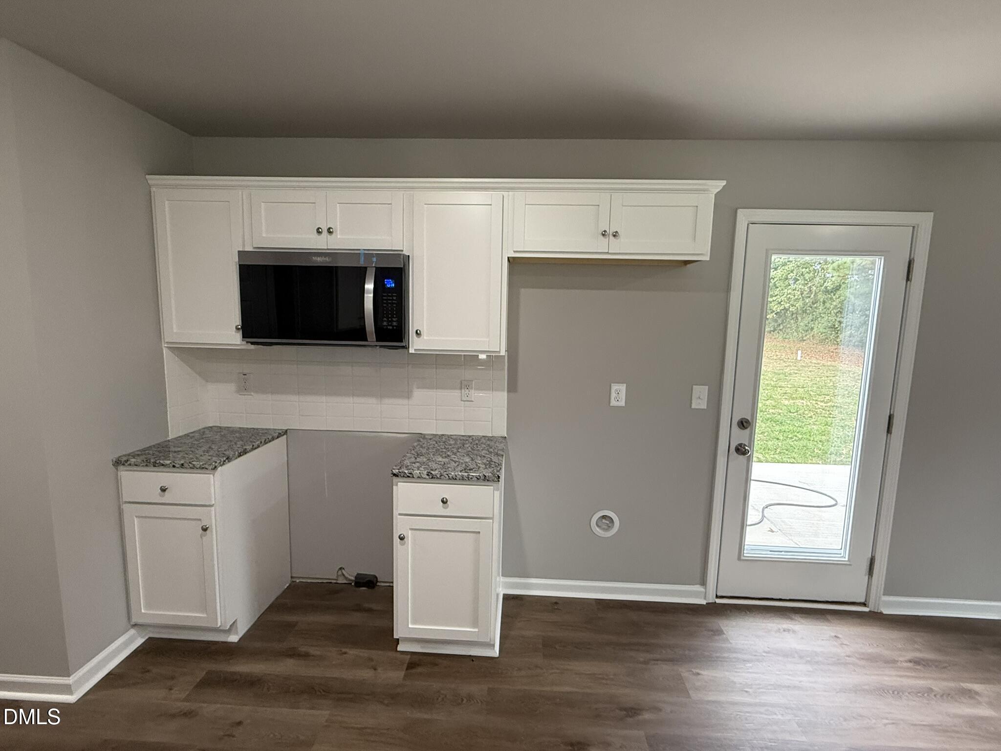 1859 Old Kenly Road Kenly, NC 27542 - Photo 11 of 22 a view of kitchen with wooden floor and electronic appliances