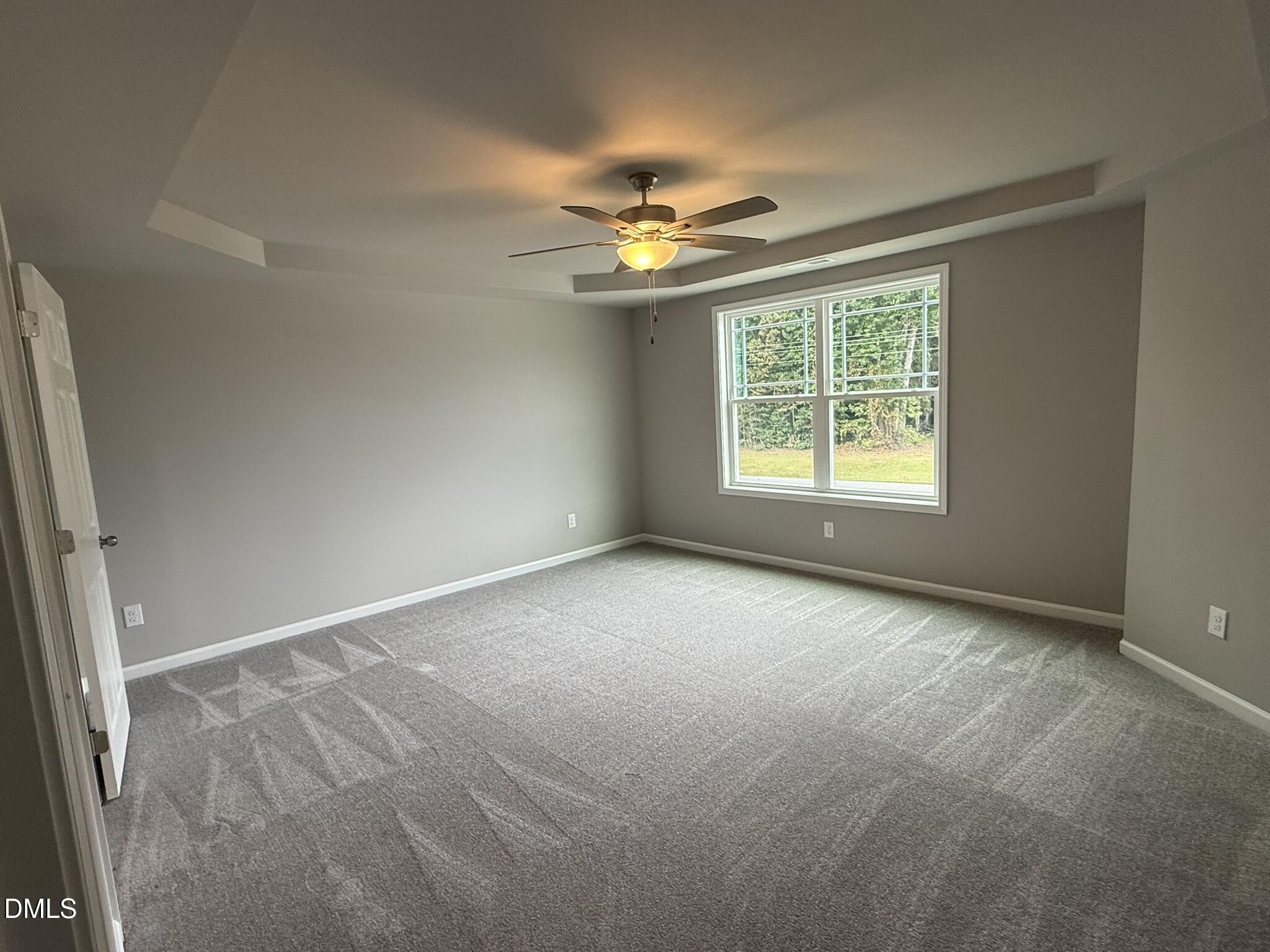 1859 Old Kenly Road Kenly, NC 27542 - Photo 13 of 22 an empty room with windows and fan