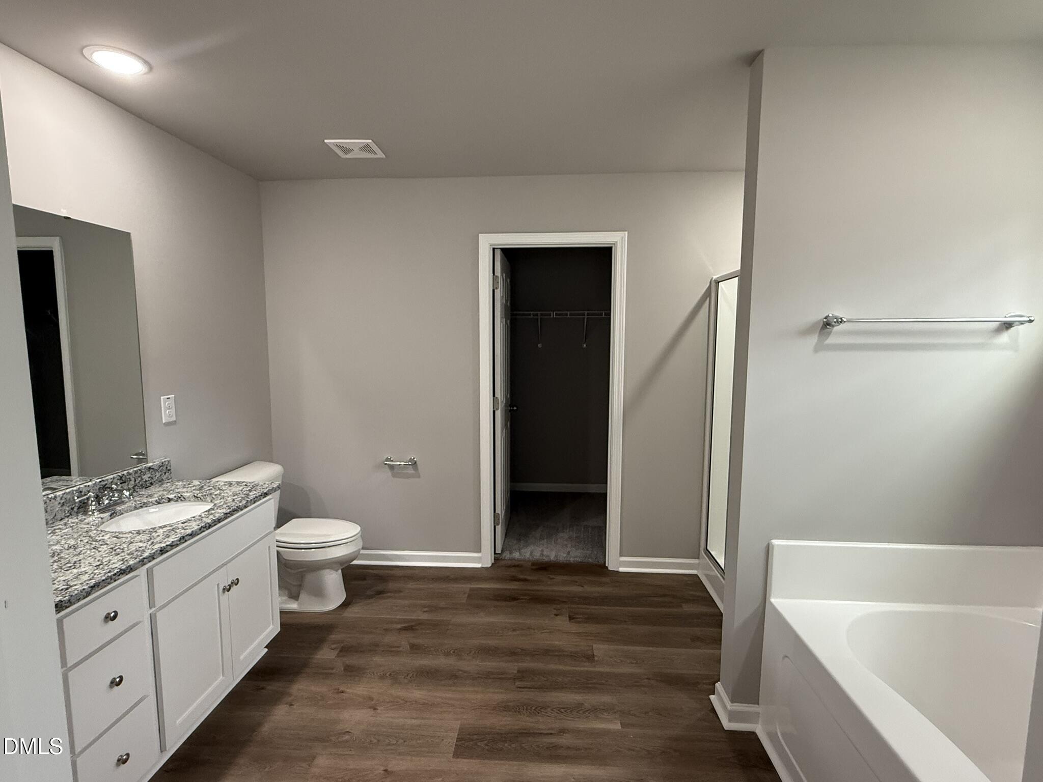 1859 Old Kenly Road Kenly, NC 27542 - Photo 15 of 22 a bathroom with a granite countertop sink toilet and shower