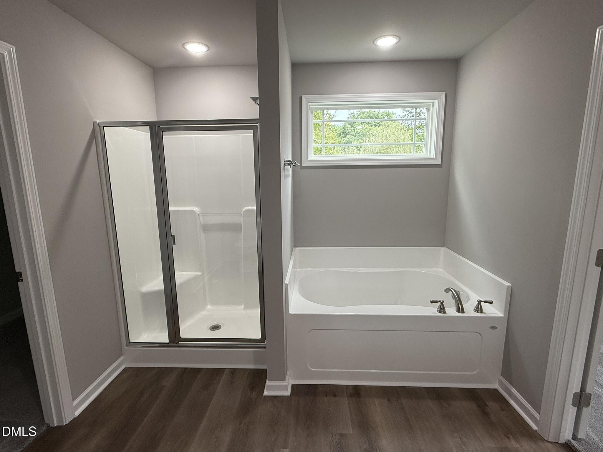 1859 Old Kenly Road Kenly, NC 27542 - Photo 16 of 22 a bathroom with a bathtub and a shower