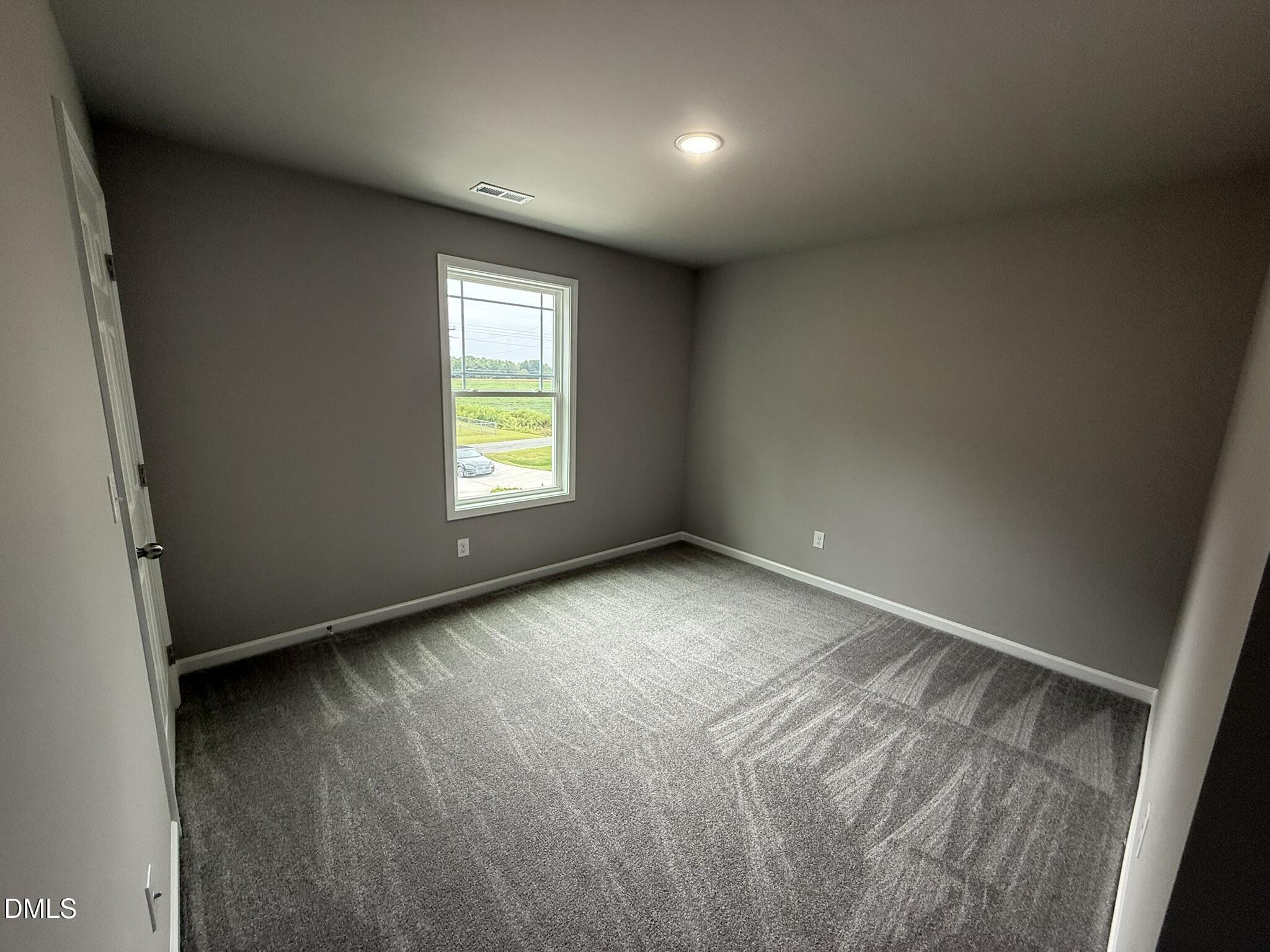 1859 Old Kenly Road Kenly, NC 27542 - Photo 19 of 22 an empty room with windows