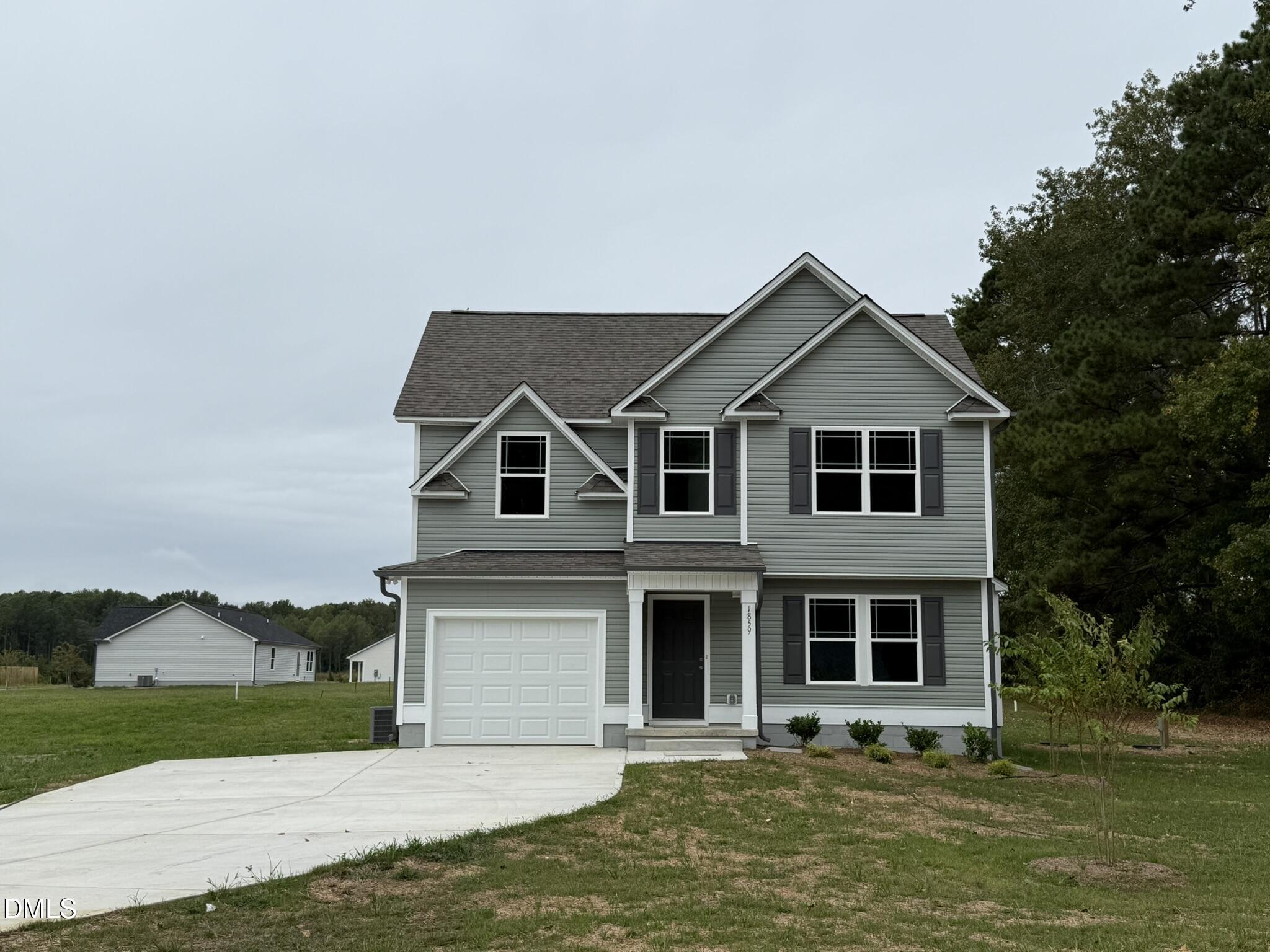 1859 Old Kenly Road Kenly, NC 27542 - Photo 3 of 22 a front view of a house with a yard