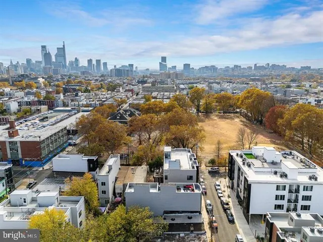 an aerial view of a city with lots of residential buildings