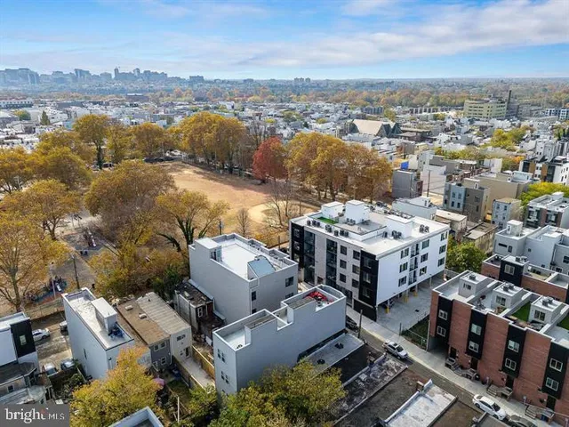 an aerial view of a house with a lake view