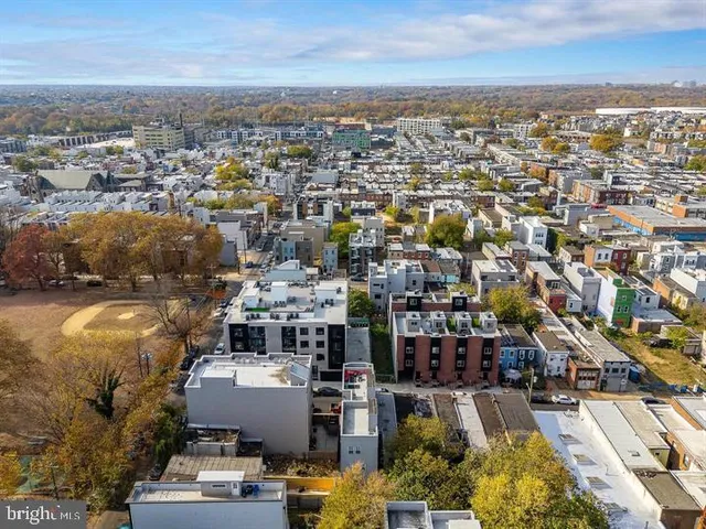 an aerial view of a city with lots of residential buildings