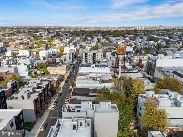 an aerial view of a city with lots of residential buildings
