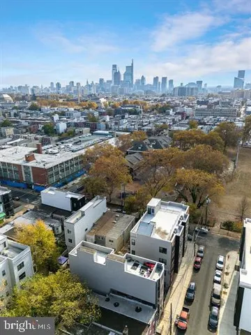 an aerial view of a city with lots of residential buildings