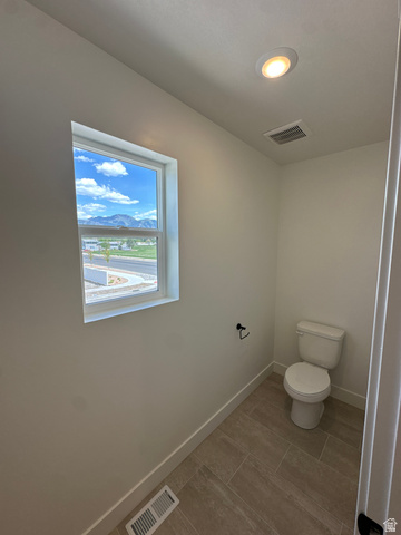 1225 West 500 South Logan, UT 84321 - Photo 37 of 39 Powder room featuring a single window, recessed lighting, and tile flooring
