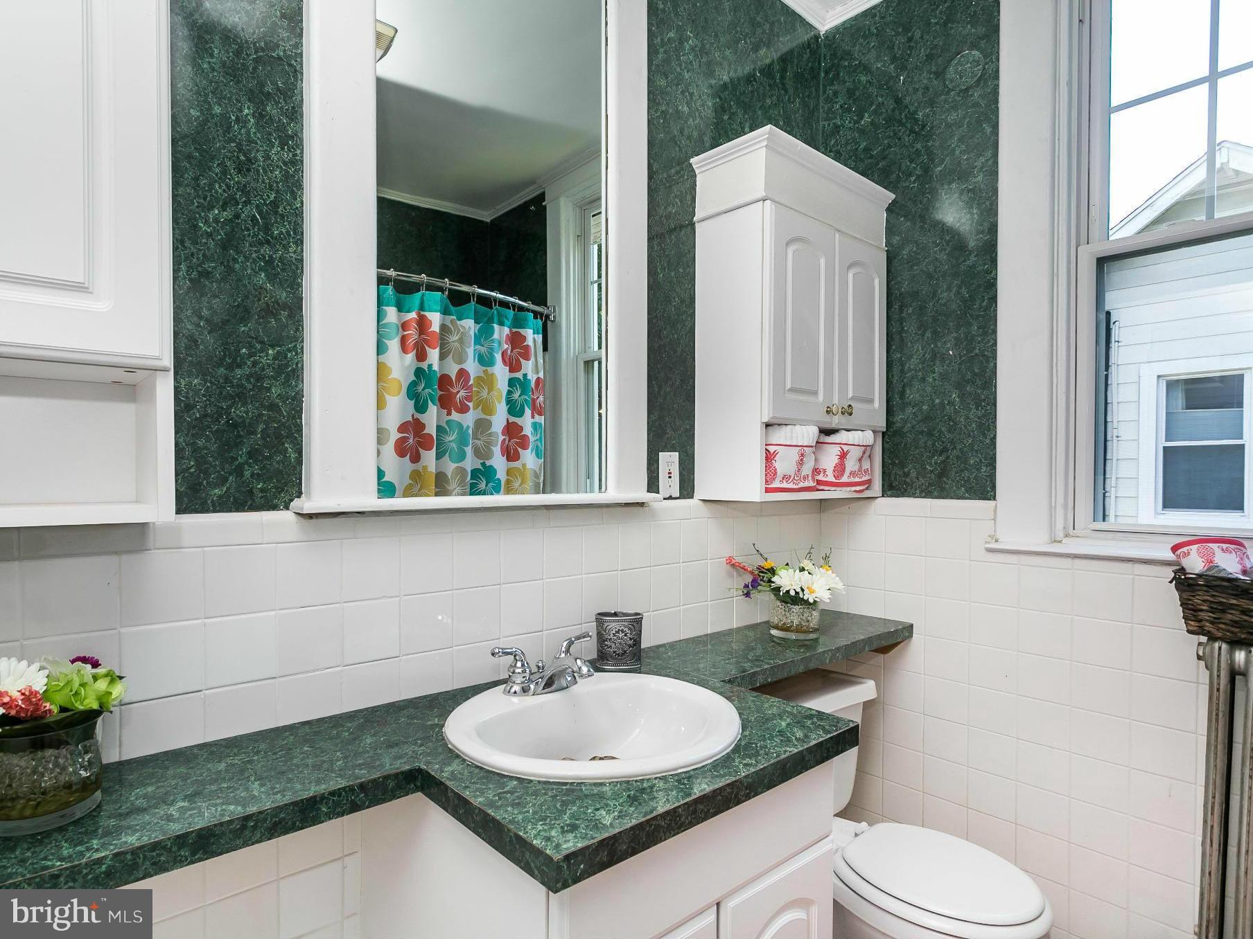 3229 Marnat Road Baltimore, MD 21208 - Photo 22 of 30 a bathroom with a granite countertop sink and a mirror