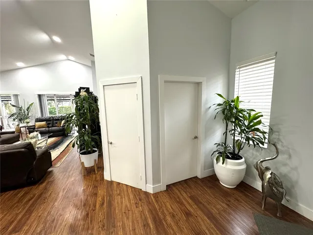 a view of a living room and hardwood floor