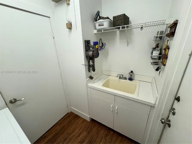 a utility room with a shower and toilet