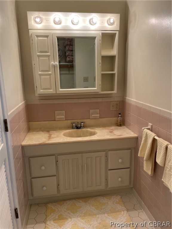 1266 Queenstown Road Lancaster, VA 22503 - Photo 40 of 46 a bathroom with a sink and a mirror