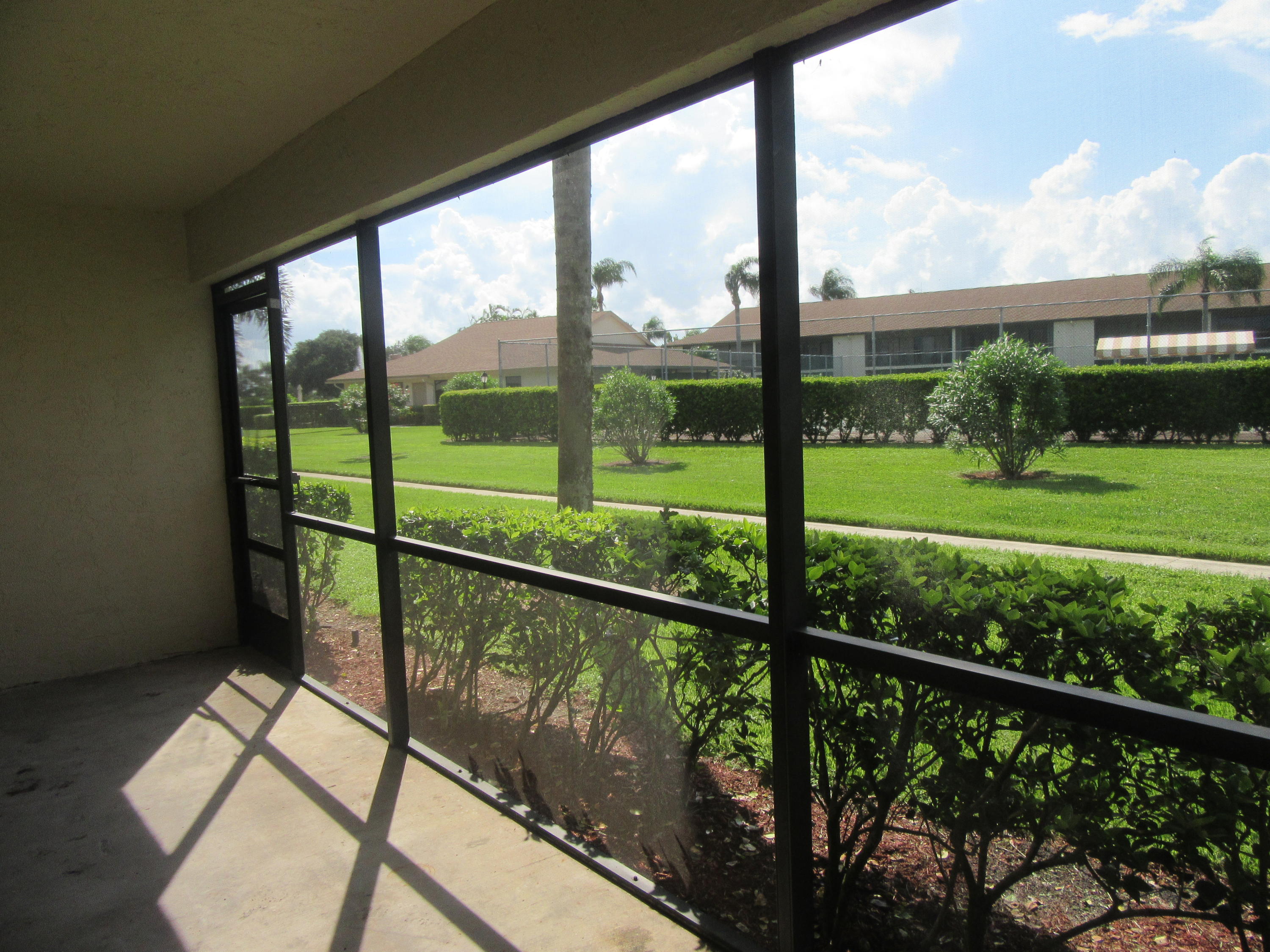 901 Pinecrest Circle, Unit D Jupiter, FL 33458 - Photo 15 of 24 Screened patio