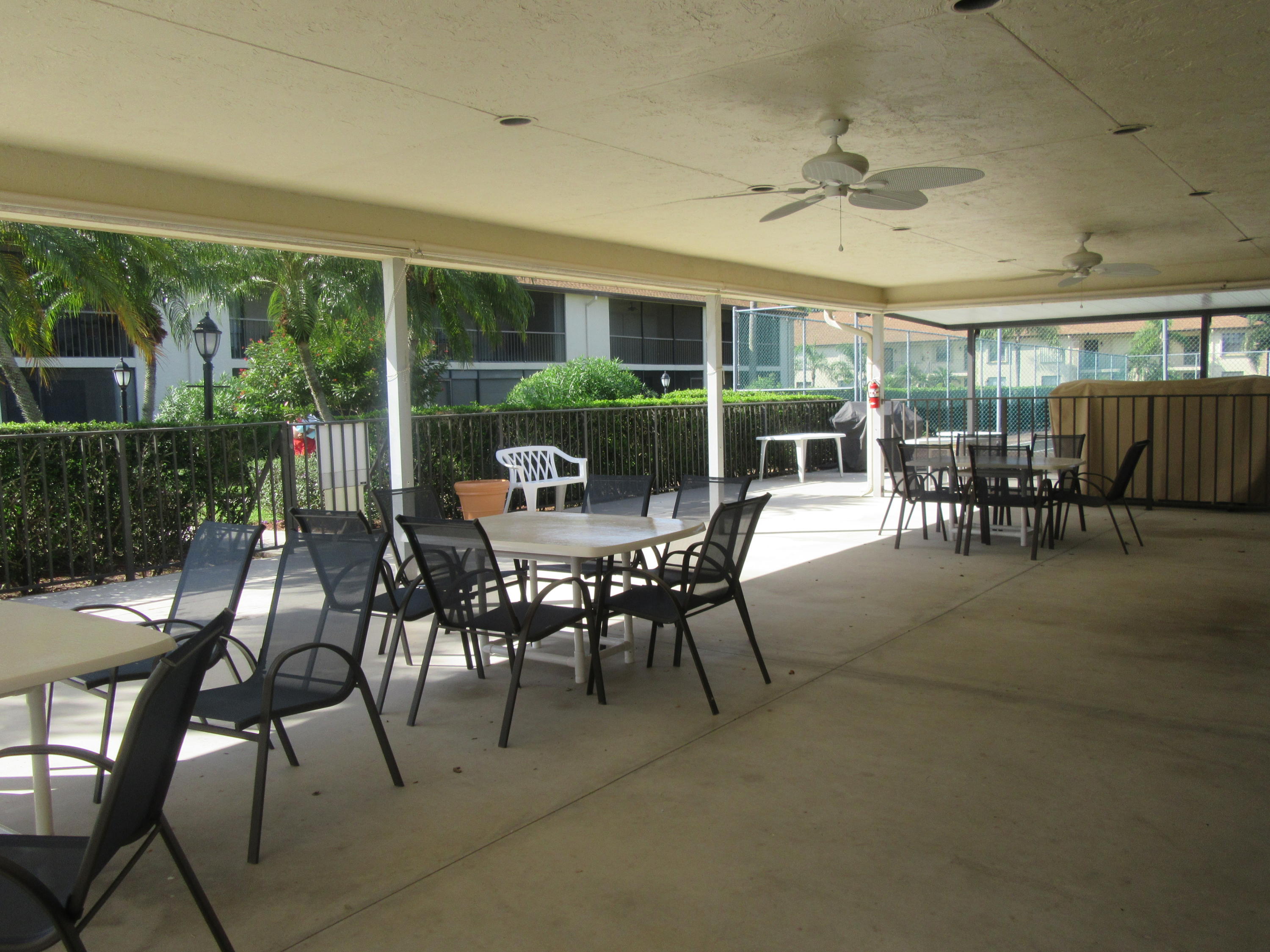 901 Pinecrest Circle, Unit D Jupiter, FL 33458 - Photo 23 of 24 Clubhouse Patio