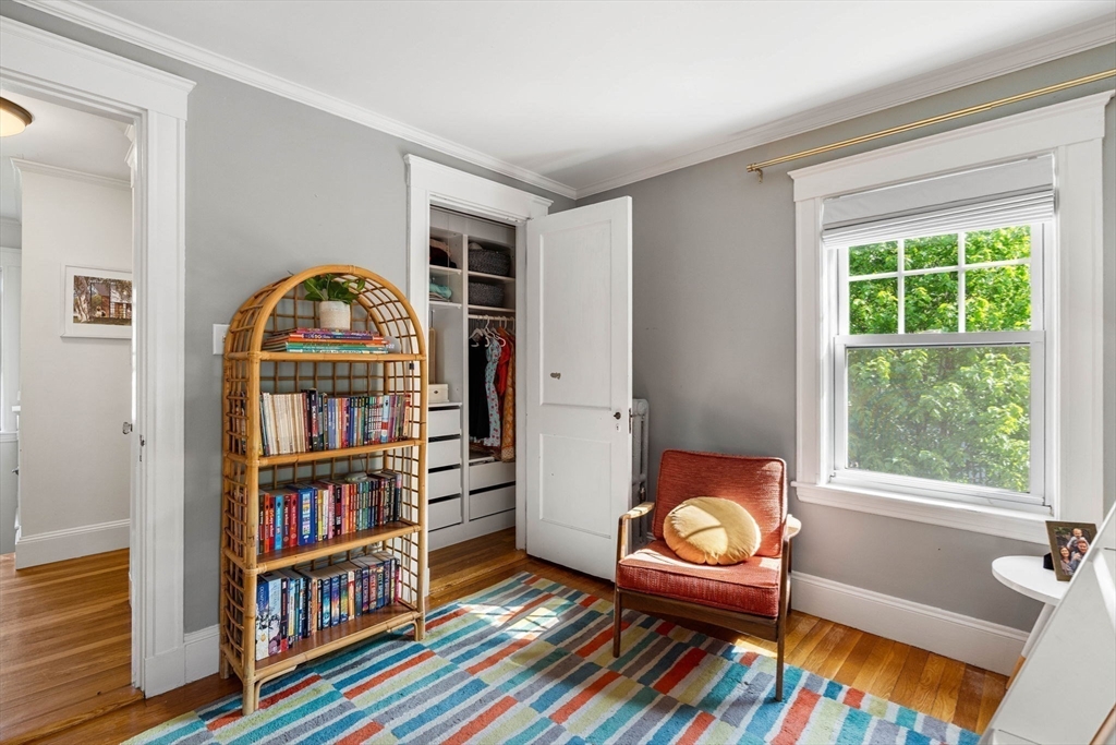 34 Avalon Road Milton, MA 02186 - Photo 34 of 42 a living room with bookshelf and a window
