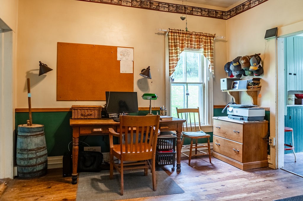 67 Fisk Road Bovina, NY 13753 - Photo 19 of 48 Rich hardwood flooring adds timeless warmth to this functional workspace.