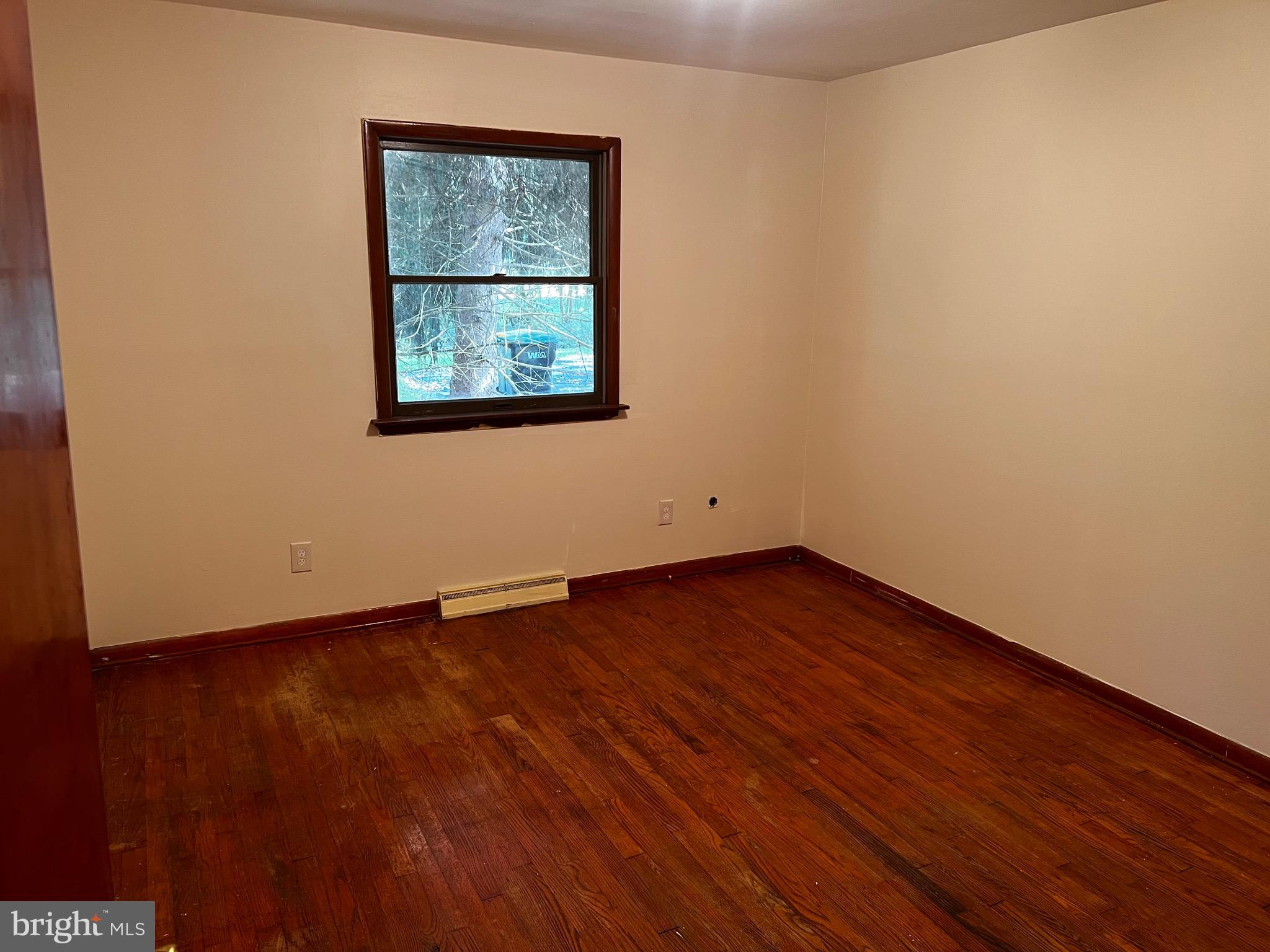 355 Wedgewood Road Newark, DE 19711 - Photo 15 of 20 an empty room with wooden floor and windows