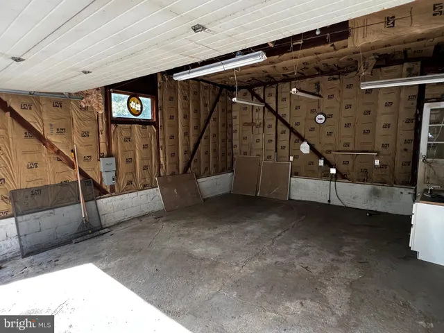 a view of an empty room with stairs