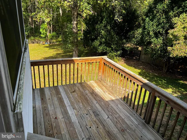 a view of balcony with wooden floor