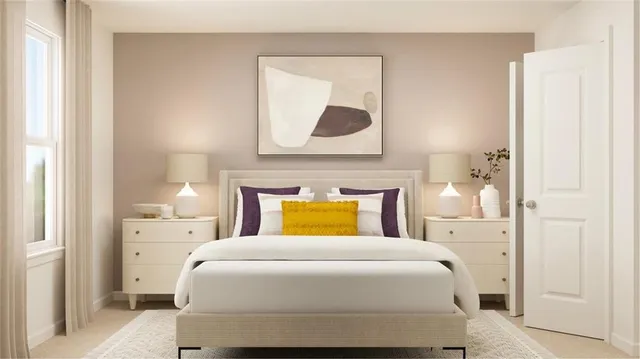 a bedroom with a bed and painting on the wall