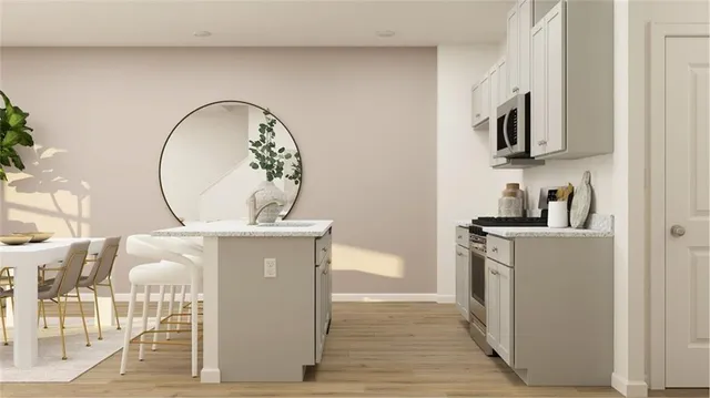 a bathroom with a sink mirror and vanity