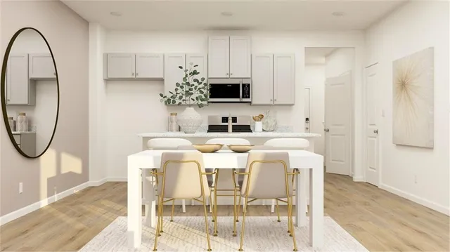 a dining room with furniture a mirror and a wooden floor