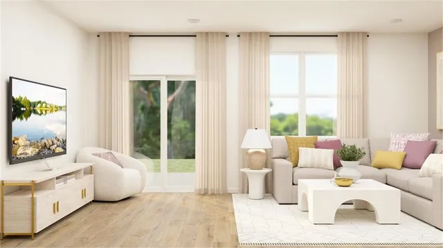 a living room with furniture and a large window