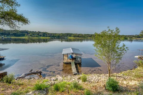 a lake with a building in the background