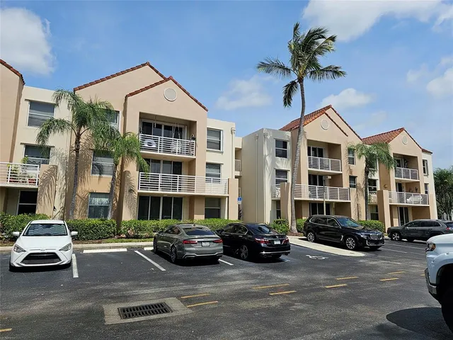 a car parked in front of a brick building