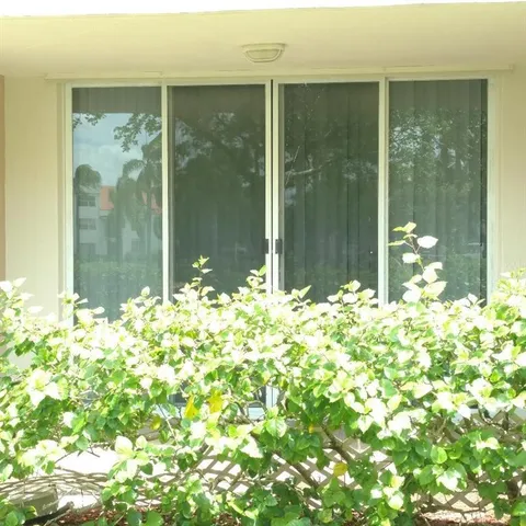 a view of a glass door and porch