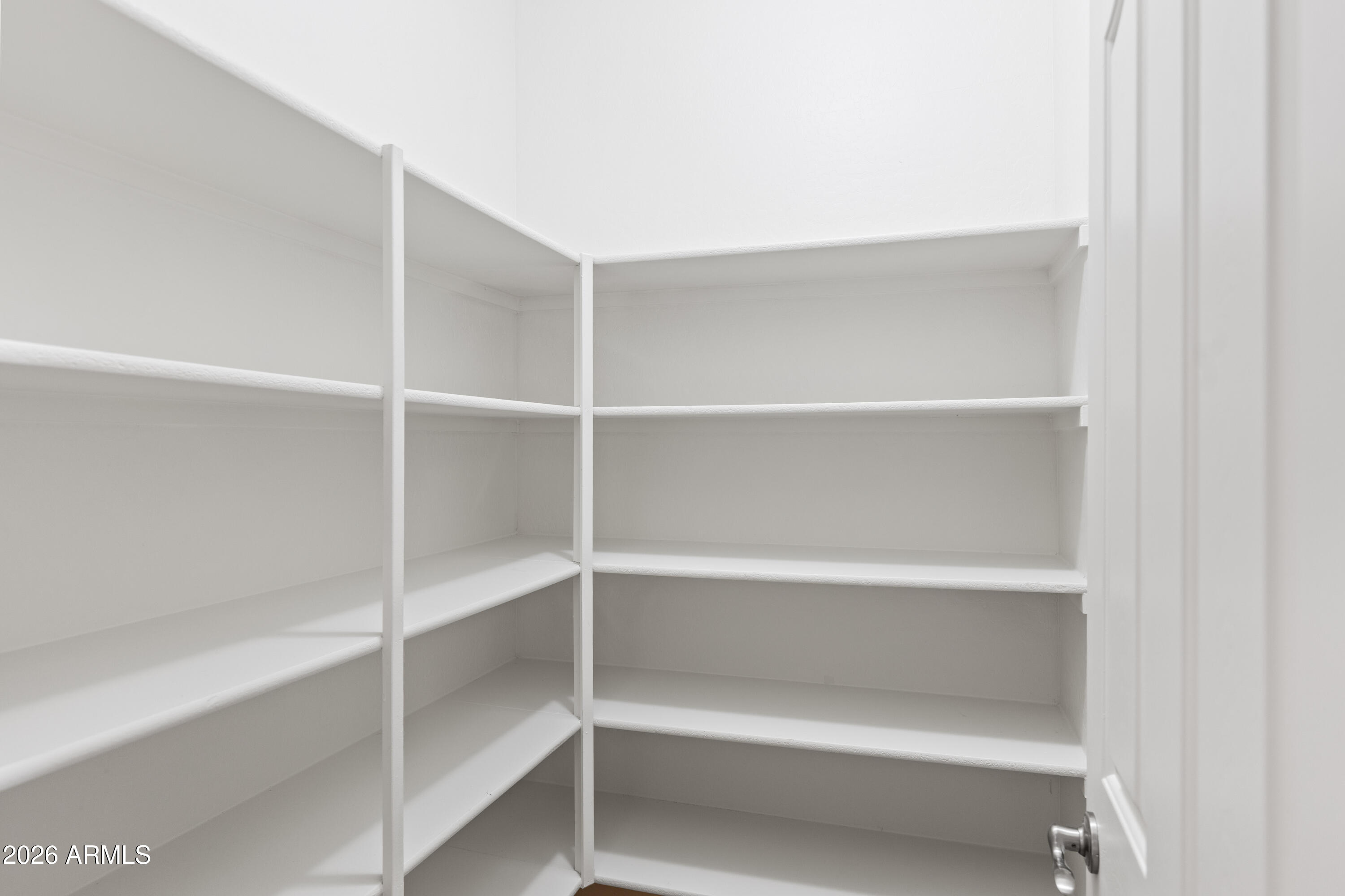 9840 Tangerine Road Florence, AZ 85132 - Photo 15 of 38 a view of an empty walk in closet