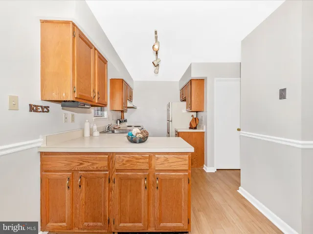 a bathroom with a sink vanity granite and a mirror