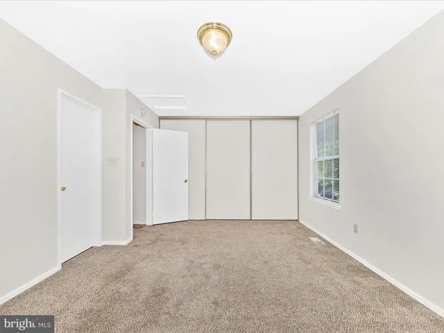 a view of an empty room with windows