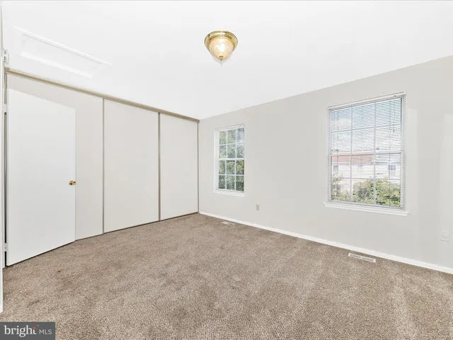 a bathroom with a sink a toilet and shower curtain