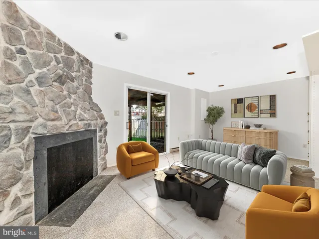 a view of an empty room with a fireplace