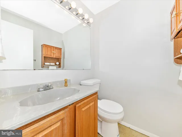 a utility room with a shower and vanity