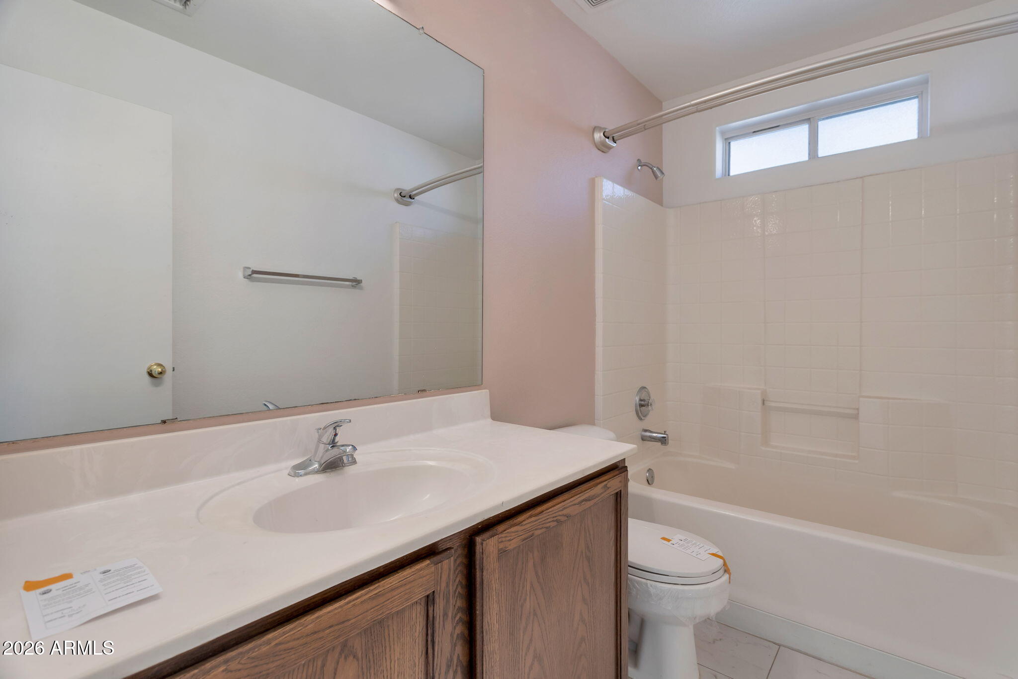4545 North 67th Avenue, Unit 1211 Phoenix, AZ 85033 - Photo 12 of 16 a bathroom with a sink toilet vanity and shower