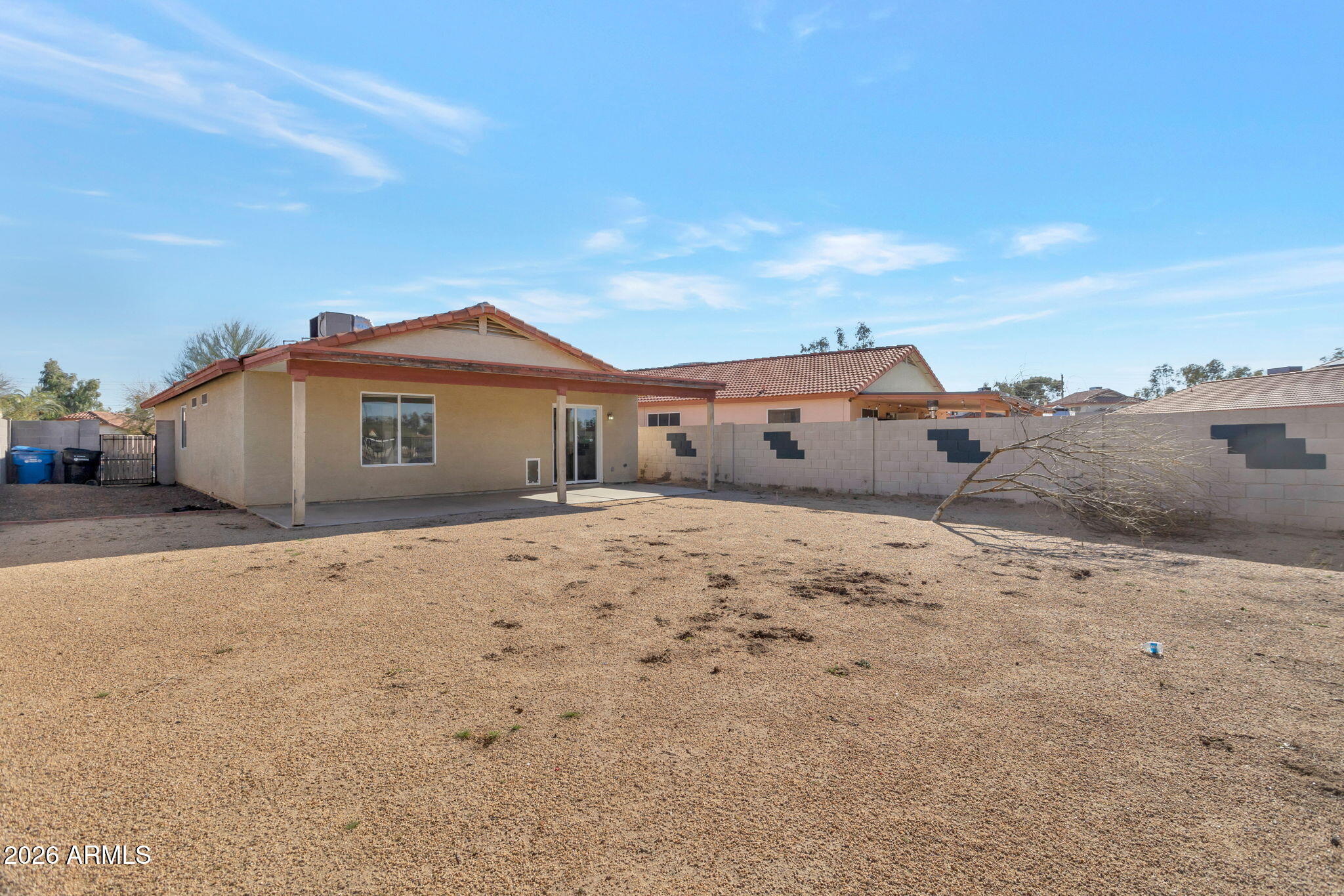 4545 North 67th Avenue, Unit 1211 Phoenix, AZ 85033 - Photo 15 of 16 a big house with a beach and trees in the background
