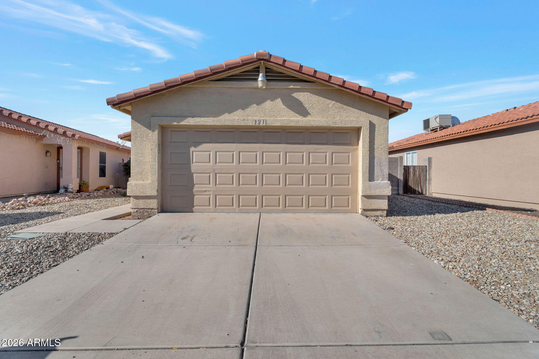 4545 North 67th Avenue, Unit 1211 Phoenix, AZ 85033 - Photo 4 of 16 a front view of a house with a yard