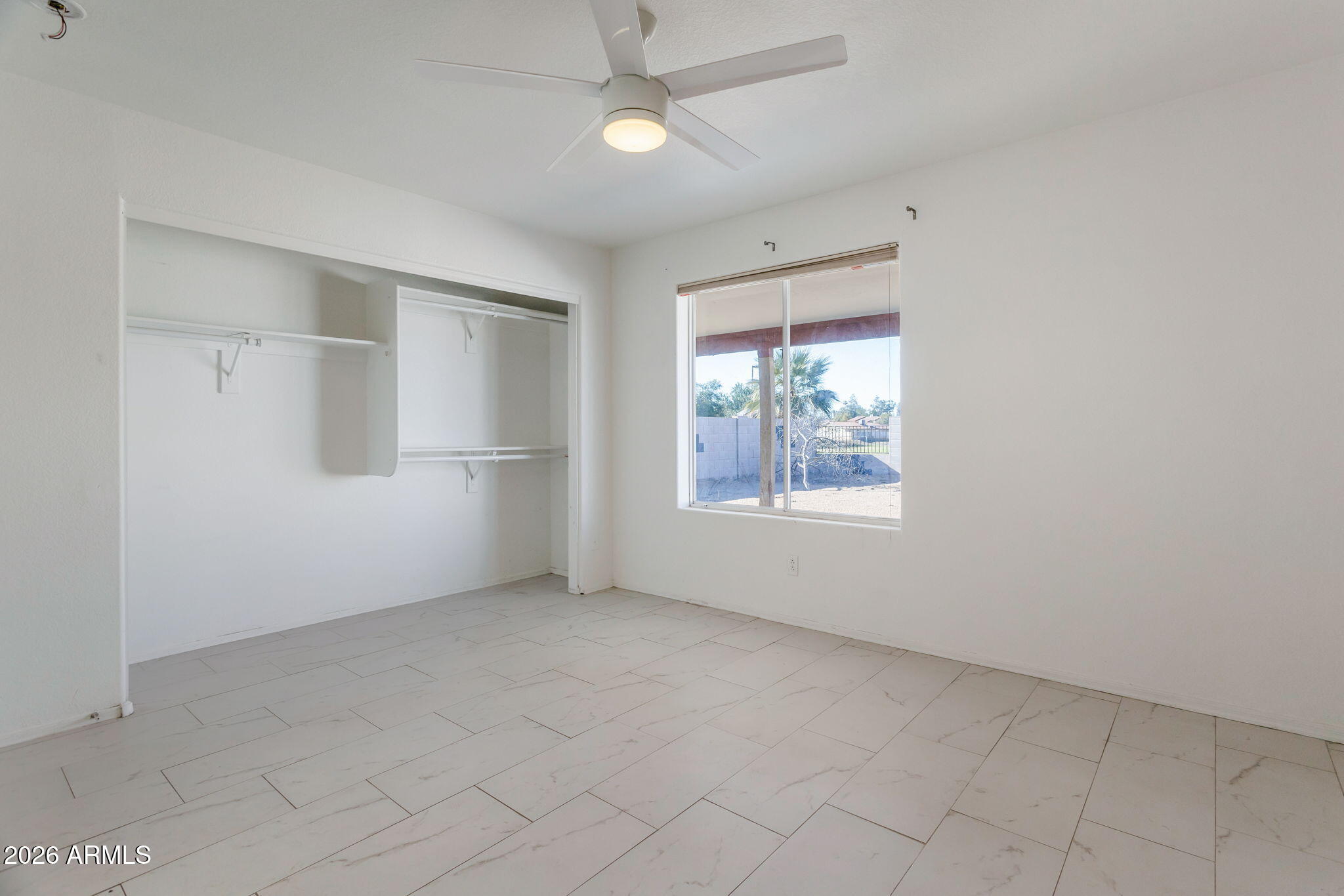 4545 North 67th Avenue, Unit 1211 Phoenix, AZ 85033 - Photo 10 of 16 an empty room with windows and closet