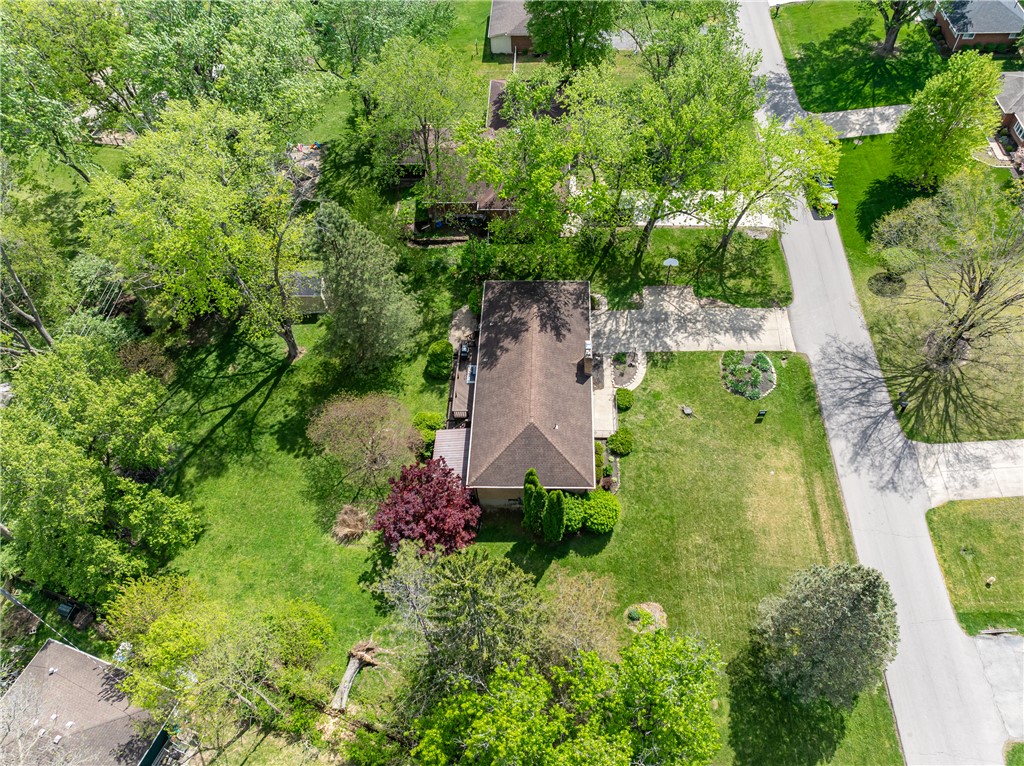 1176 Geneva Road Dayton, OH 45434 - Photo 49 of 55 An aerial view showcases a residential property surrounded by lush greenery