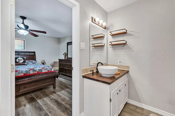 a bedroom with bed and cabinets