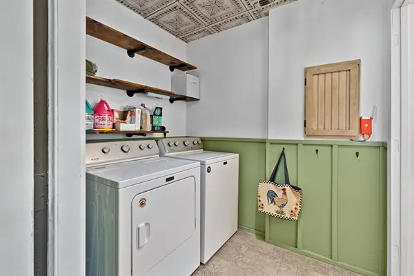 a utility room with dryer and washer