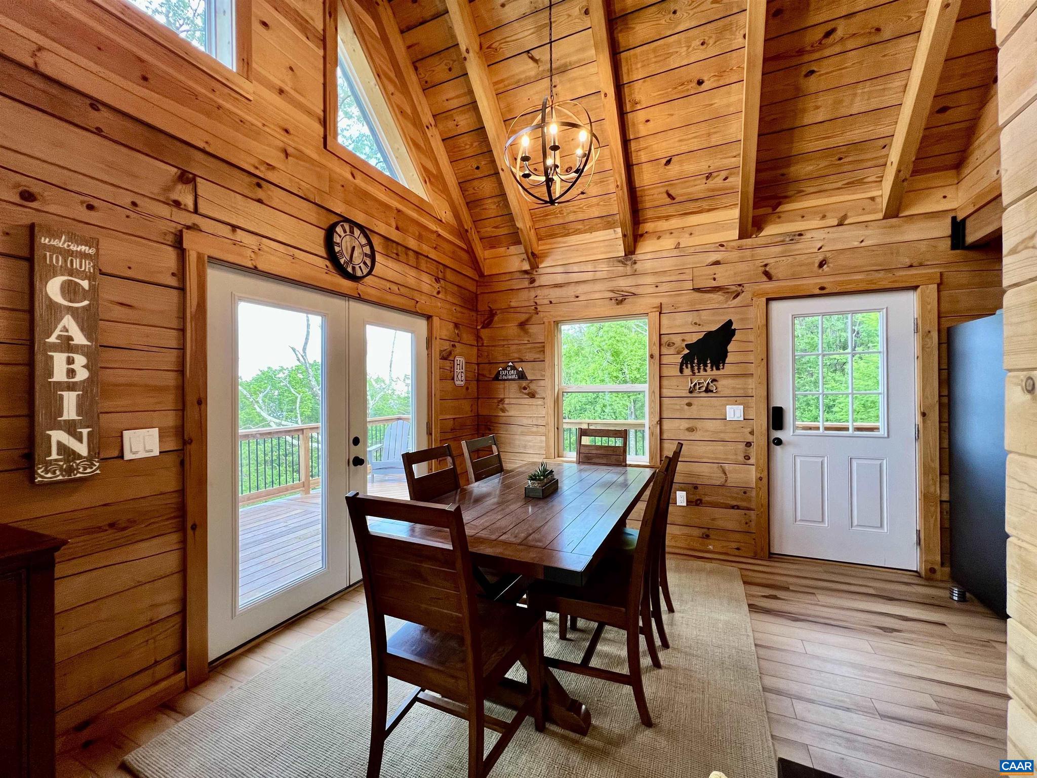 248 Raven Way Free Union, VA 22940 - Photo 8 of 47 a view of a dining room with furniture window and wooden floor