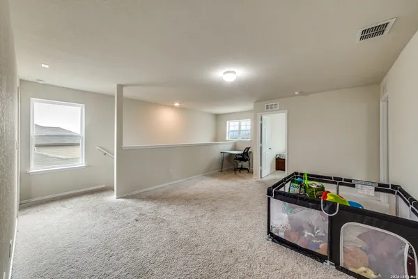 a room with furniture and a window