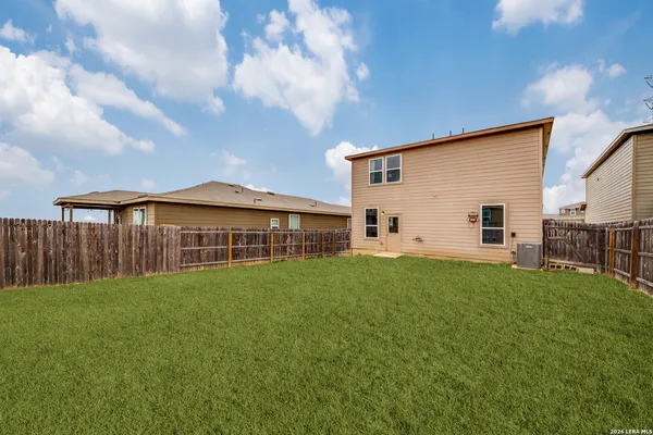 a view of a yard in front of a house