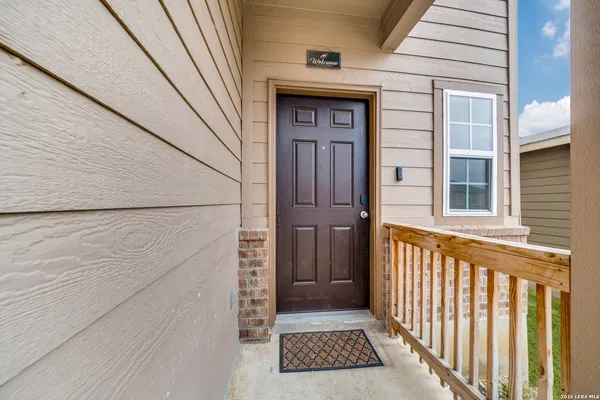 a view of a house with a door and wooden floor