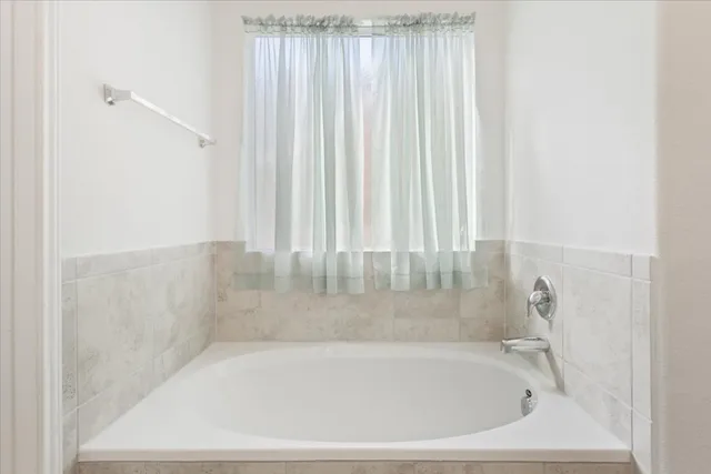 a close up of a bathtub in a bathroom